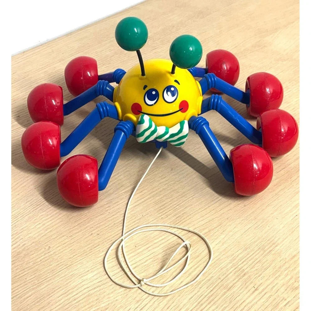 Vintage 1999 Tomy Pull Along Spider Toy Yellow Blue Red Rolling Wheels Bow Tie
